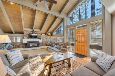 a large living room with a wooden ceiling at Three-Bedroom House in South Lake Tahoe