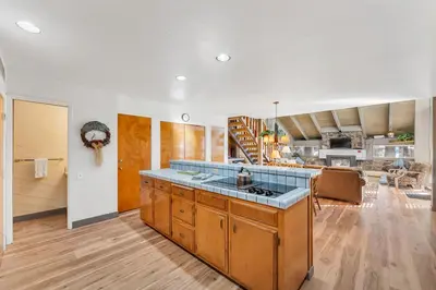 a kitchen with wooden cabinets and a counter top at Three-Bedroom House in South Lake Tahoe