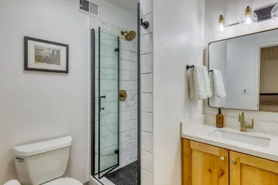 a bathroom with a shower and a toilet and a sink at Inviting Tahoe Escape in Incline Village