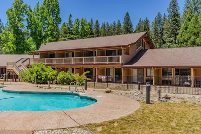 a house with a swimming pool in front of it at Amador Hotel in Pioneer