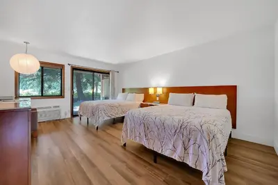 a hotel room with two beds and a kitchen at Amador Hotel in Pioneer