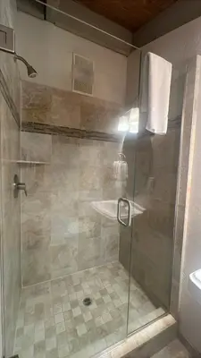 a shower with a glass door in a bathroom at Sky Lake Splendor condo in South Lake Tahoe
