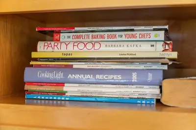 a stack of books sitting on a shelf at Shaquinaw! home in South Lake Tahoe