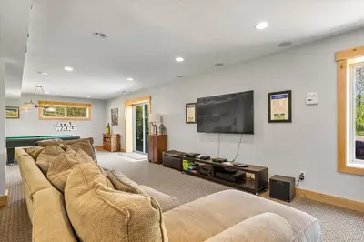 a living room with a couch and a flat screen tv at Shaquinaw! home in South Lake Tahoe