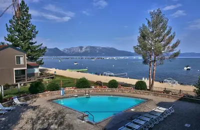 a swimming pool with a view of the water at Bear Lake Hideaway condo in South Lake Tahoe