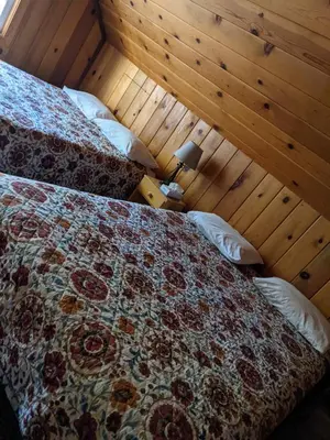 a bedroom with two beds in a room at Cabin #3 in Strawberry