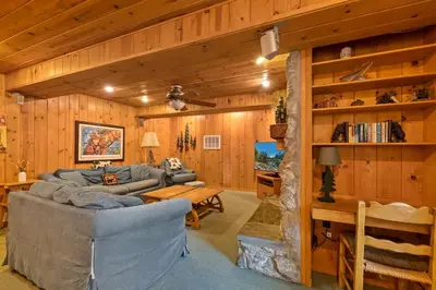 a living room with a couch and a table at Cabin #5 in Strawberry