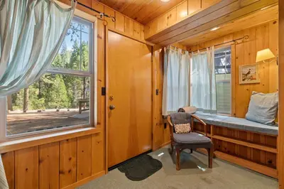 a bedroom with a desk and a window in a cabin at Cabin #5 in Strawberry