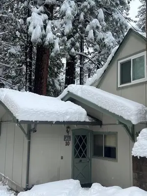 a garage with snow on the top of it at Cabin #10 in Strawberry