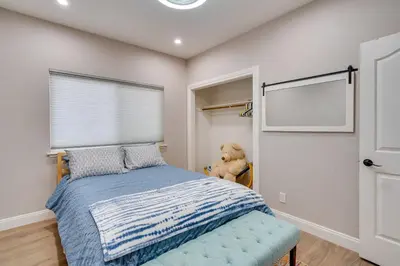 a bedroom with a bed and a teddy bear at Private Dock Discovery Bay Vacation Rental! in Discovery Bay