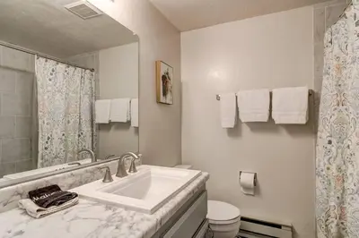a white bathroom with a sink and a toilet at Heavenly Mountain Lake Retreat Near Skiing, Hiking & Biking in Stateline