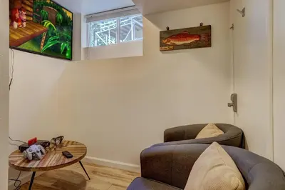 a living room with a couch and a table at Spacious Lakeview Heavenly Mountain Escape! in Stateline