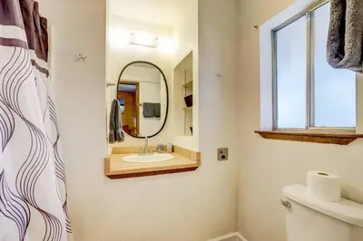 a bathroom with a sink and a mirror at Spacious Lakeview Heavenly Mountain Escape! in Stateline