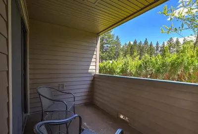 two chairs sitting on a porch with a large window at Heavenly Lakeside Retreat Close to downtown in South Lake Tahoe