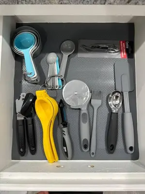 a drawer filled with kitchen utensils in a drawer at Cozy Getaway with King bed & 70inTV in Carmichael