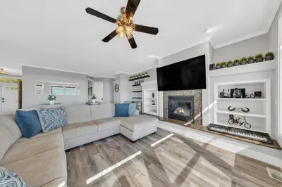 a living room with a couch and a fireplace at Luxe & Comfy Vineyard Estate ~ Breathtaking Views! in Clarksburg