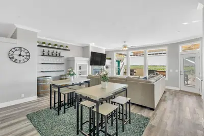 a living room with a couch and a table and chairs at Luxe & Comfy Vineyard Estate ~ Breathtaking Views! in Clarksburg