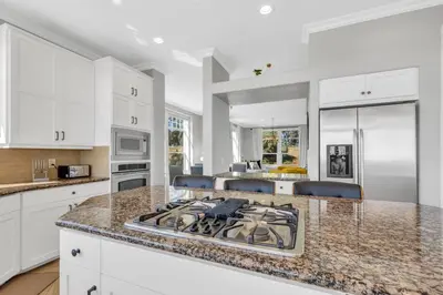 a kitchen with white cabinets and a stove top oven at Luxe & Comfy Vineyard Estate ~ Breathtaking Views! in Clarksburg