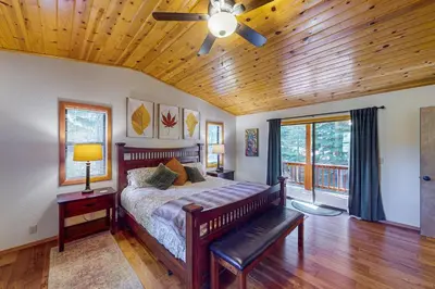 a bedroom with a bed and a ceiling fan at Hansel Hideaway in Truckee