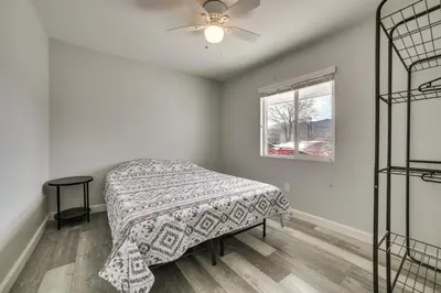a bedroom with a bed and a ceiling fan at Updated Hawthorne Apartment, 12 Mi to Walker Lake! in Hawthorne