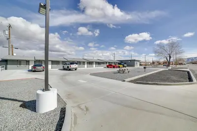 a parking lot with a street sign on a pole at Updated Hawthorne Apartment, 12 Mi to Walker Lake! in Hawthorne