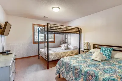 a bedroom with two beds and a bunk bed at Minutes To Heavenly, Private Covered Hot Tub in South Lake Tahoe