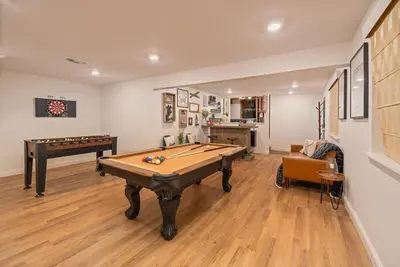 a living room with a pool table and a couch at Sugarpine Trailhead Lodge at Lewis Creek Upper Trailhead just 7 miles from Yosemite in Oakhurst