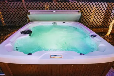 a jacuzzi tub with a green liquid in it at Yosemite Country House sleeps 20 w/ hot tub, firepit, bonus studio in Oakhurst