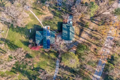 an aerial view of a house in a forest at Log Cabin sleeps 20 with hot tub, EV Charger, firepit in Ahwahnee