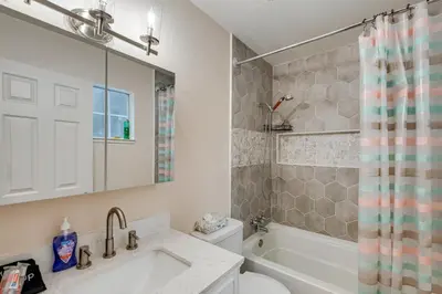 a bathroom with a tub and a toilet and a sink at Renovated Pioneer Home in Serene Wooded Setting! in Pioneer
