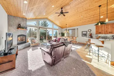 a living room with a couch and a fireplace at Sunny Daze Cabin Luxurious 4BDR with Stunning Views in Kings Beach