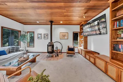a living room with a couch and a tv at Talmont Pines 4BR Retreat with HOA Beach Access in Tahoe City