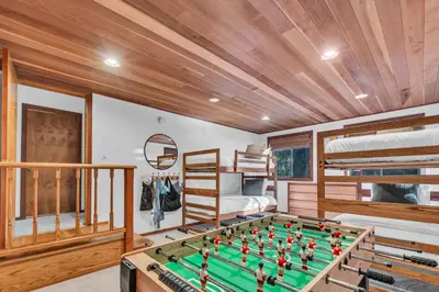 a room with a pool table and bunk beds at Talmont Pines 4BR Retreat with HOA Beach Access in Tahoe City