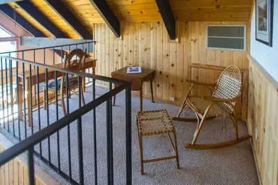 a room with two chairs and a table in a cabin at Carnelian Bay View Cabin in Carnelian Bay