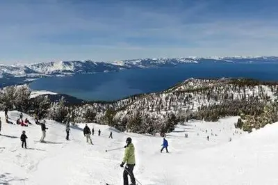 a group of people skiing down a snow covered slope at Mt Airy Cottage Walk to Beach in Tahoe Vista