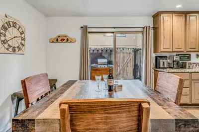 a dining room with a wooden table and chairs at Modern 3BD -Walk to Lake & Beach in Tahoe City