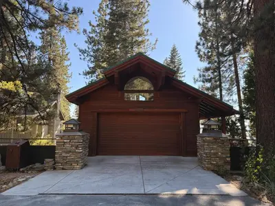 a garage with a large wooden garage door at Lakeview Hideaway in Kings Beach