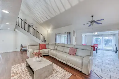 a living room with a couch and a table at Fig Garden 4BR House W Pool in Fresno
