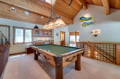 a pool table in a room with wooden ceilings at One Moose Lodge with Hot Tub in Tahoe Donner in Truckee