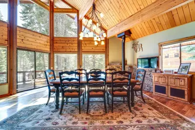 a dining room with a table and chairs at One Moose Lodge with Hot Tub in Tahoe Donner in Truckee