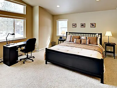 a bedroom with a bed and a desk and a computer at Black Bear Cabin in South Lake Tahoe