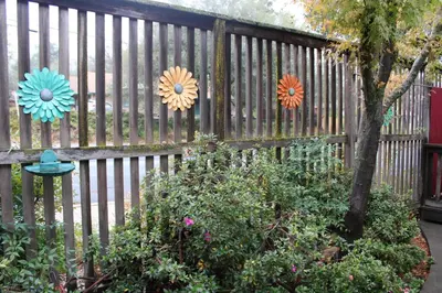 a fence with some paper flowers on it at The Bonnie Inn Unit 1 in San Andreas