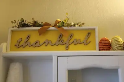 a shelf with a thankful sign on top of a cabinet at The Bonnie Inn Unit 1 in San Andreas