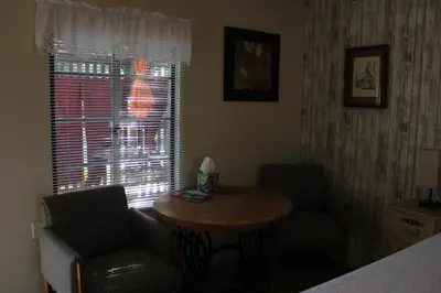 a room with a table and a chair and a window at The Bonnie Inn Unit 1 in San Andreas