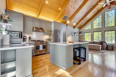 a kitchen with an island in a large room at Private Ski, Lake & Golf Chalet! Walk to Lake in Tahoe Vista