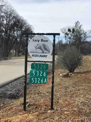 a sign for a law bar on the side of a road at Cozy Cub Cabin, brand new home near Yosemite in Mariposa