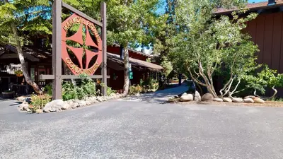 a building with a sign on the side of a road at Mammoth Estates #225 condo in Mammoth Lakes