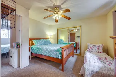 a bedroom with a bed and a ceiling fan at Serene Groveland Cabin Rental Near Yosemite! in Groveland