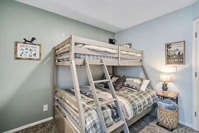 a bedroom with a bunk bed with a ladder at The Nut House - Lovely Home with Hot Tub home in Groveland
