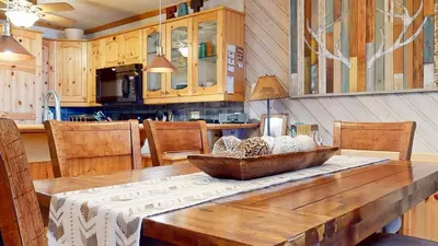 a kitchen with a wooden table with a bowl on it at Aspen Creek #227 condo in Mammoth Lakes